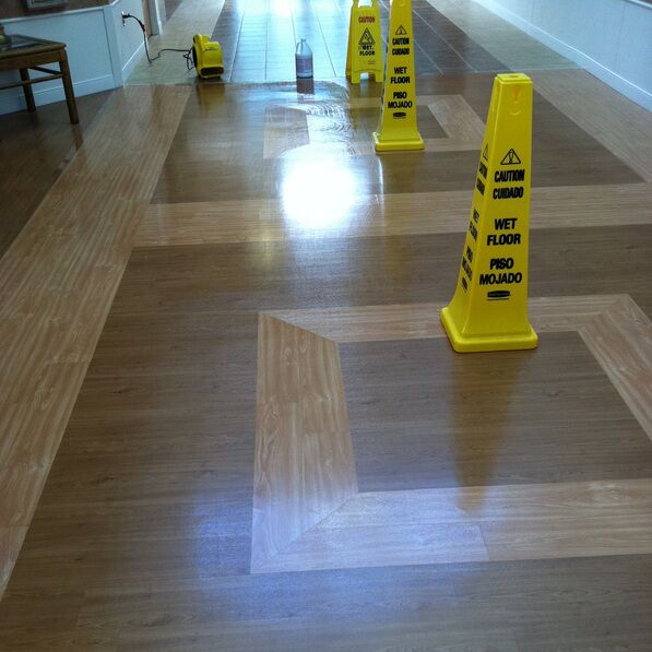 Caution: Wet Floor sign on wooden floor